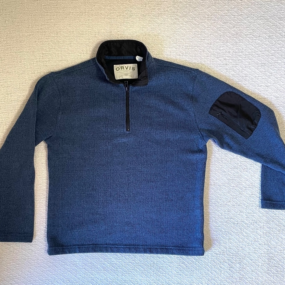 Orvis 1/4 zip pullover with arm pocket. Blue long-sleeve.
